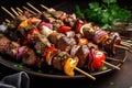 platter of grilled beef shishkabob, ready to be skewered and enjoyed