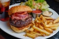 platter with halfeaten burger, side of fries, soda