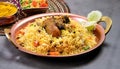 A platter of traditional Sindhi biryani, known for its aromatic flavors and colorful appearance