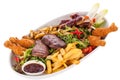 Platter of mixed meats, salad and French fries