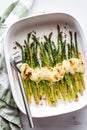 A platter of roasted asparagus topped with mozzarella cheese and panko. Royalty Free Stock Photo