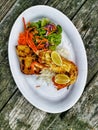 A platter of seafood with lobster served on a rustic wooden table Royalty Free Stock Photo