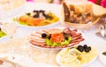 Platter of sliced ham,salami and cured meat with vegetable decoration on festive table Royalty Free Stock Photo