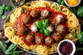 platter of spaghetti and meatballs with basil, cheese, and spices for garnish Royalty Free Stock Photo