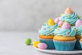 A platter of tasty Easter cupcakes sits on the table, featuring vibrant candy eggs, festive decor, and spring Royalty Free Stock Photo