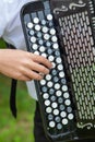 Play the accordion. Close-up, outside on the lawn Royalty Free Stock Photo