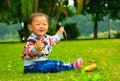 Play alone the little girl was glad to bristlegrass(Asia, China, Chinese) Royalty Free Stock Photo