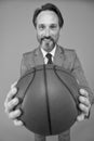 Play basketball be happy. Happy businessman hold basketball ball. Basketball coach grey background. Basketball coaching