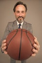 Play basketball be happy. Happy businessman hold basketball ball. Basketball coach grey background. Basketball coaching