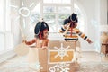 Play, box ship or pirate children point at fantasy fish, role play, or pretend in cardboard container. Boat trip, fun Royalty Free Stock Photo