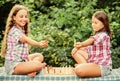 Play chess. Sisters playing chess. Children play chess outdoors nature background. Cognitive development. Intellectual