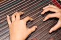 children Play chinese zither with hands