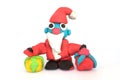 Play doh sculpture of Santa Claus on white background