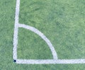 Play field corner, green grass texture of football or soccer field. Marked corner Royalty Free Stock Photo