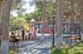Children kids playground with play equipment outdoor. Kids playground with slides in the park. Pine trees . play ground colorfull