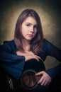 Play guitar...Beautiful teen girl playing music with a guitar Royalty Free Stock Photo