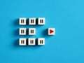 Play and pause icons on wooden cubes. Business startup, taking action and business acceleration and success