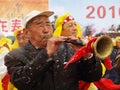 Play suona horn in the snow during Chinese New Yea