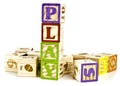 Play word in wooden block letters Royalty Free Stock Photo