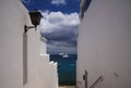 PLAYA BLANCA, LANZAROTE - JUNE 14. 2019: View along white walls of house on ferry arriving from Fuerteventura