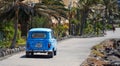 Classic Renault Car being driven along Playa Blanca seafront promenade.