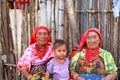 Playa Chico village, Panama - August, 4, 2014: Three generations of kuna indian women in native attire sell handcraft clothes