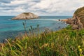 Playa de Covachos beach in Santander, Cantabria, North Spain with rocky island and sandy spit. Popular travel