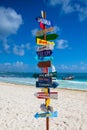 Funny direction signpost with distance to many different countries on Mexican coastline. Royalty Free Stock Photo