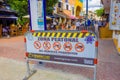 Playa del Carmen, Mexico - January 10, 2018: Informative sign of all vehicles prohibited with unidentified people