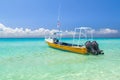 Yellow speedboat on the beach of Playacar at Caribbean Sea of Mexico.