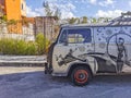 Old black broken dirty VW bus Volkswagen car rusting Mexico