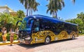 Colorful mexican yellow black travel bus Playa del Carmen Mexico