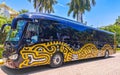 Colorful mexican yellow black travel bus Playa del Carmen Mexico