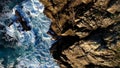 Waves Crashing against large rock pillars - Aerial Video - Playa del Silencio, Asturias, Spain