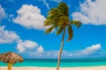 Playa Esmeralda, Holguin, Cuba. Caribbean sea. Beautiful Paradise beach: umbrellas, sea, palm trees, sand.