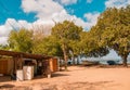 PLAYA MONTEZUMA, COSTA RICA, JUNE, 28, 2018: Outdoor view of thatched roof over sandy beach and gorgeous blue sky in