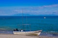 PLAYA MOTEZUMA, COSTA RICA, JUNE, 28, 2018: Outdoor view of small boat in the shore in Playa Montezuma during gorgeous