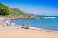 PLAYA MOTEZUMA, COSTA RICA, JUNE, 28, 2018: Unidentified people swimming and enjoying the beautiful blue water of the