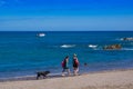 PLAYA MOTEZUMA, COSTA RICA, JUNE, 28, 2018: Unidentified people walking in the sand on the Playa Montezuma in a gorgeous