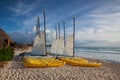 Colorful sail catamarans on the beach at Caribbean Sea of Mexico.