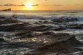 Playa Pelada Sunset on Waves of Rock Royalty Free Stock Photo