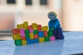 A playdough character with smily face building a wall Royalty Free Stock Photo