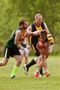 Player Avoids Being Tackled In Amateur Australian Rules Football Game