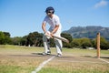 Player batting at field against clear sky Royalty Free Stock Photo