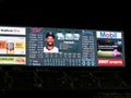 Player Byron Buxton on scoreboard screen with ads in bleachers at Safeco Field