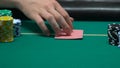 Player checking his cards and going all-in, victory confidence, justified risk