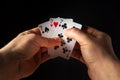 The player hands hold playing cards with a winning combination of three of a kind or set. Success at poker Royalty Free Stock Photo