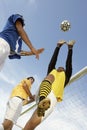 Player Heading Soccer Ball While Goalkeeper Trying To Save It Royalty Free Stock Photo