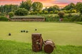 Player playing Lawn bowls in a lush green field with leather bags on the side Royalty Free Stock Photo