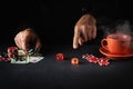 The player points his finger at the maximum in the winning combination when playing craps in a poker club. Luck or luck in the